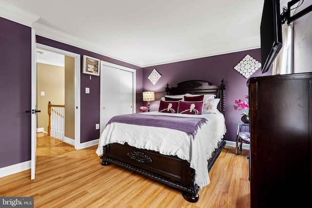 bedroom featuring ornamental molding and hardwood / wood-style flooring