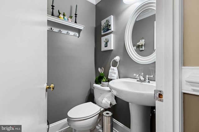 bathroom featuring sink and toilet