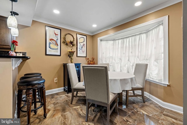 dining room with crown molding