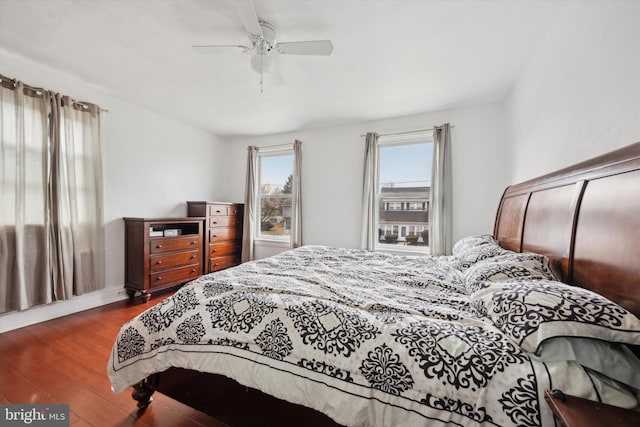 bedroom featuring ceiling fan and dark hardwood / wood-style floors