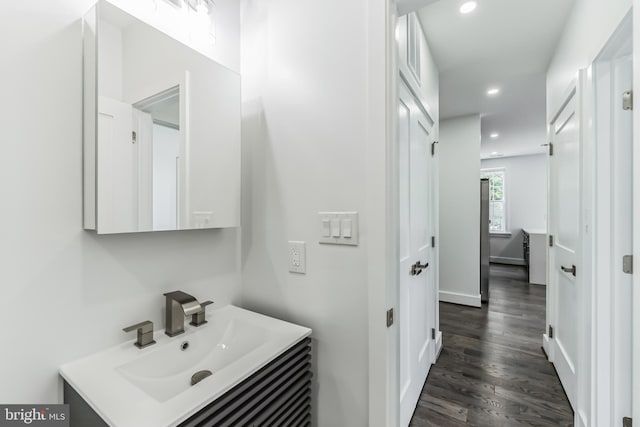 bathroom featuring vanity and hardwood / wood-style floors