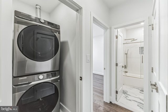 laundry area featuring stacked washer and dryer