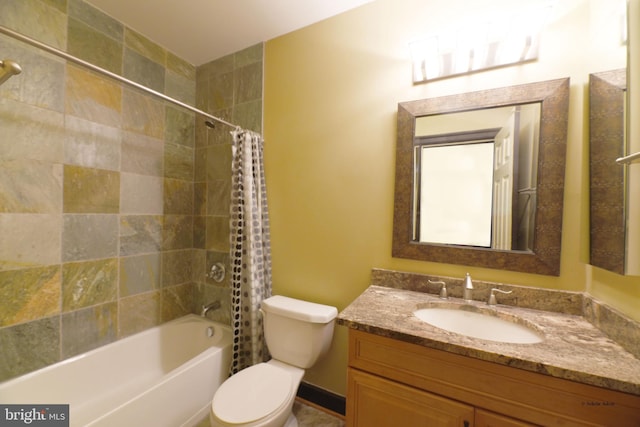 full bathroom featuring shower / bath combo with shower curtain, vanity, and toilet