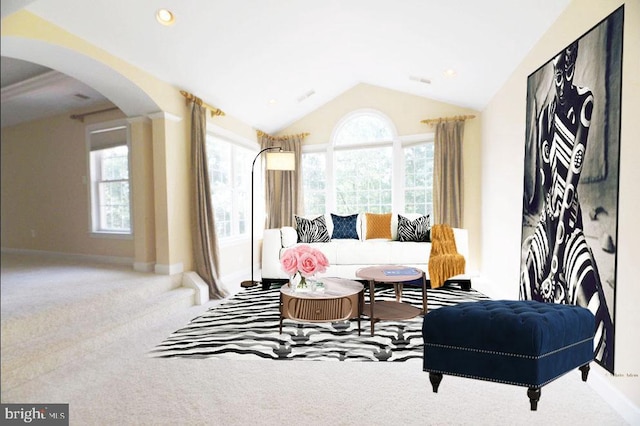 living room with light colored carpet and lofted ceiling