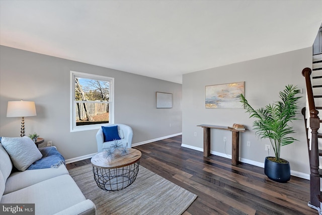 living area with dark wood finished floors and baseboards