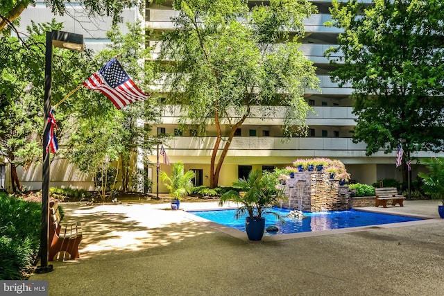 outdoor pool featuring a patio area