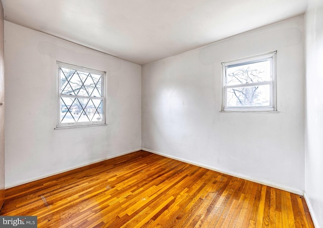 spare room featuring hardwood / wood-style flooring