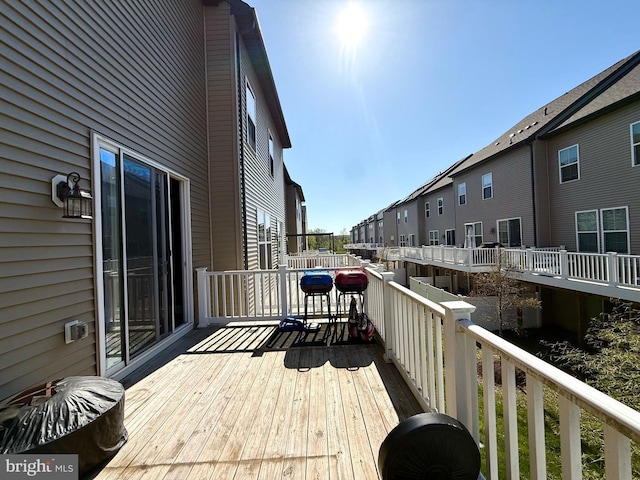 wooden deck with a residential view