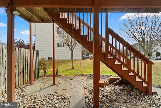 view of yard with a patio and stairway