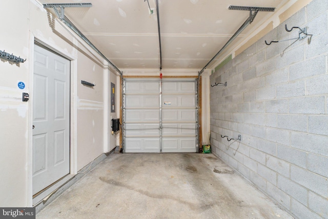 garage with concrete block wall