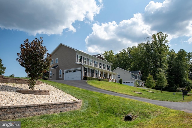 view of front facade with a garage and a front yard