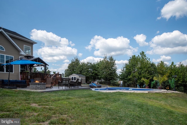 view of yard with a patio, a fire pit, a gazebo, and a fenced in pool