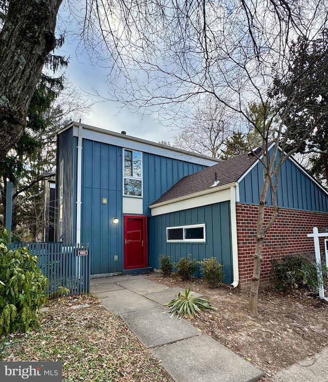 view of outdoor structure featuring fence