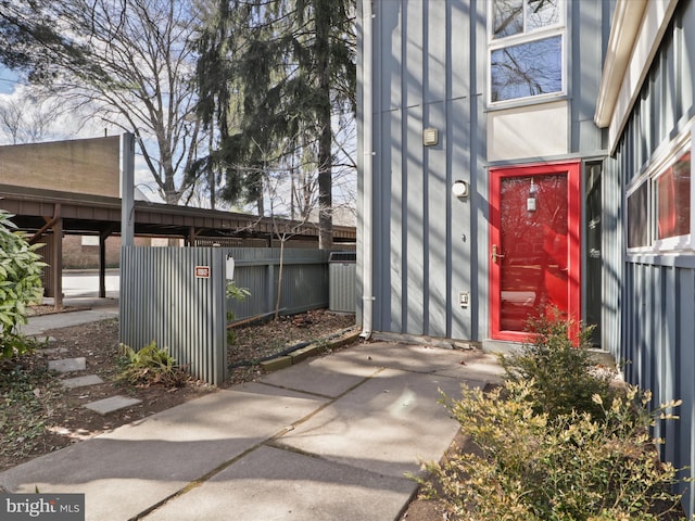 view of exterior entry with fence