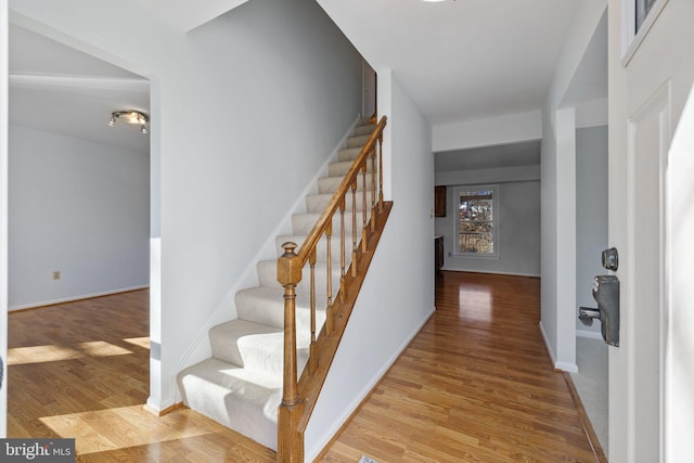 stairway featuring hardwood / wood-style floors