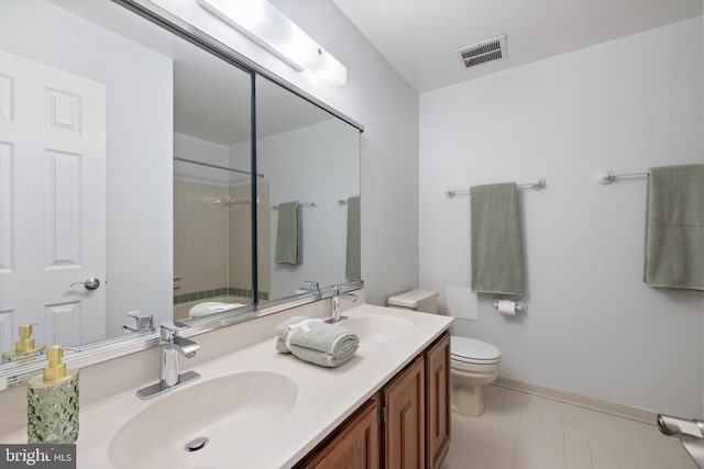 full bathroom with tiled shower / bath combo, vanity, and toilet