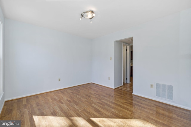 unfurnished room featuring hardwood / wood-style floors