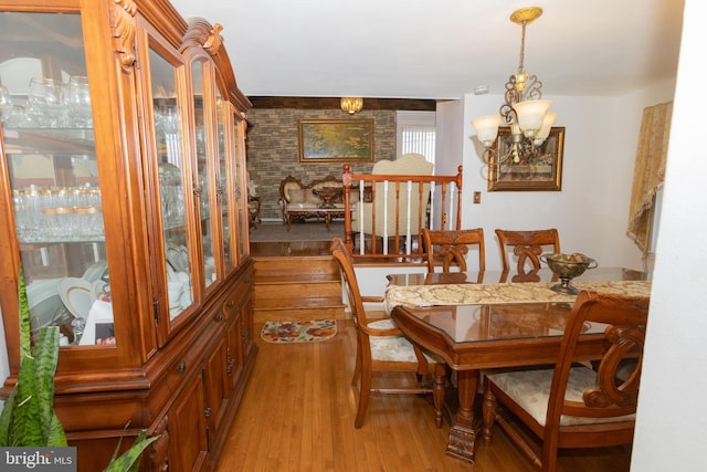 dining room featuring a chandelier and light wood-type flooring