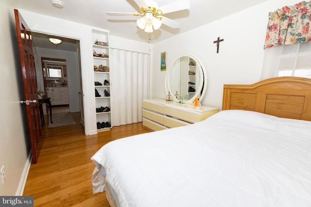 bedroom with light wood-type flooring and ceiling fan