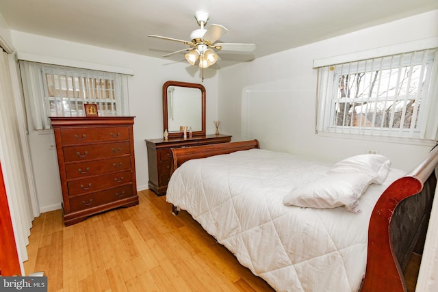 bedroom featuring a ceiling fan and light wood-style floors