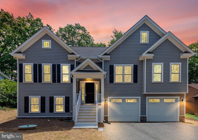 split foyer home with driveway and an attached garage