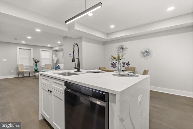 kitchen with a center island with sink, dark wood finished floors, dishwasher, white cabinetry, and a sink