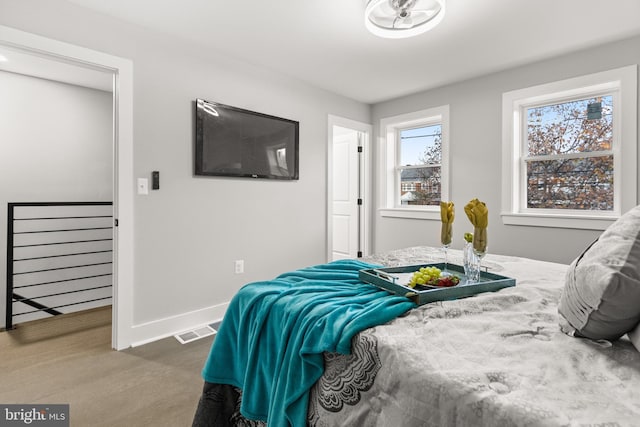 bedroom with visible vents and baseboards