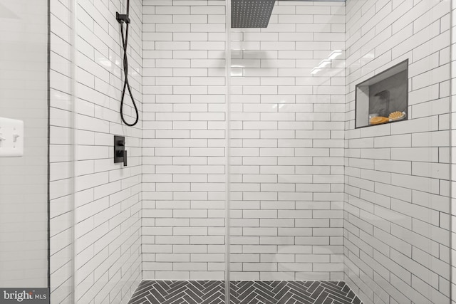 bathroom with a shower stall