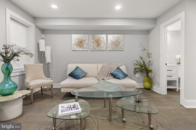 living area with recessed lighting, wood finished floors, and baseboards