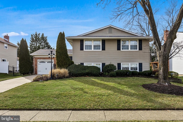 view of front facade featuring an attached garage, brick siding, fence, driveway, and a front lawn