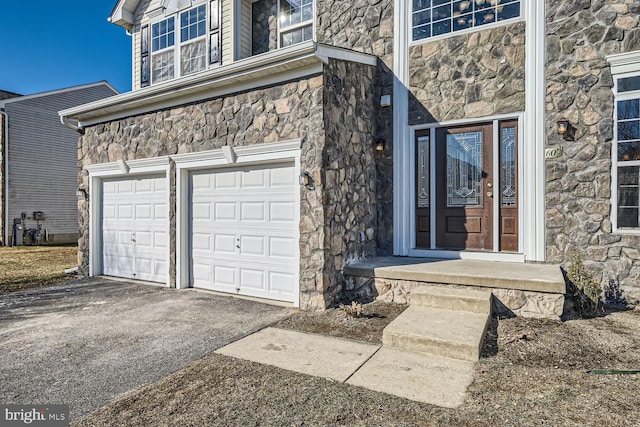 entrance to property featuring a garage