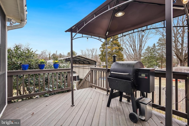 wooden deck featuring a gazebo