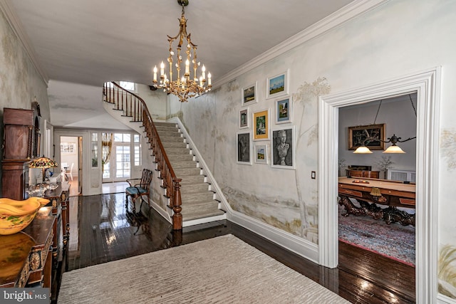 entrance foyer featuring stairs, french doors, ornamental molding, and dark wood-style flooring