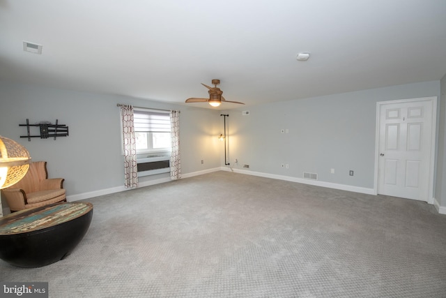 unfurnished room with visible vents, baseboards, and carpet