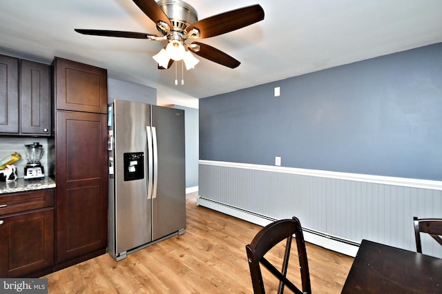 kitchen with ceiling fan, stainless steel fridge with ice dispenser, dark brown cabinetry, and light hardwood / wood-style flooring