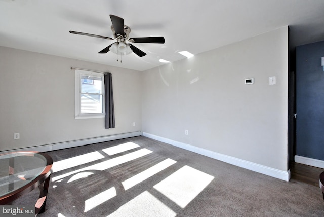 carpeted empty room featuring ceiling fan and a baseboard heating unit