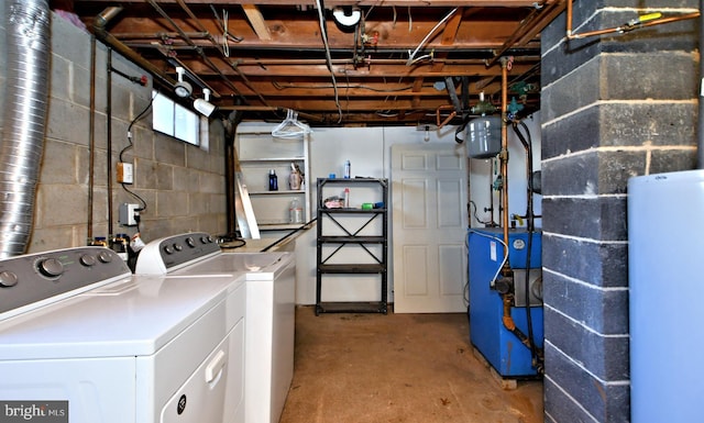 clothes washing area with independent washer and dryer and water heater