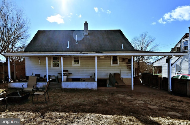 rear view of property featuring a patio area