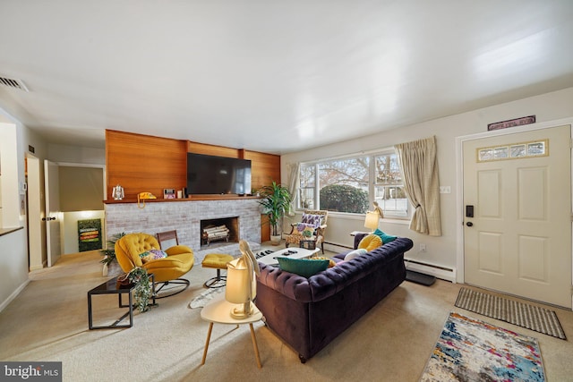 living area with carpet floors, a brick fireplace, a baseboard radiator, and baseboards