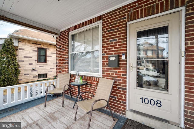 wooden deck featuring covered porch