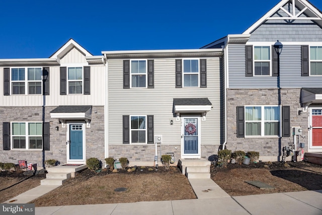 multi unit property featuring board and batten siding and stone siding