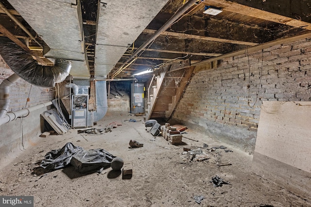 miscellaneous room featuring gas water heater and heating unit