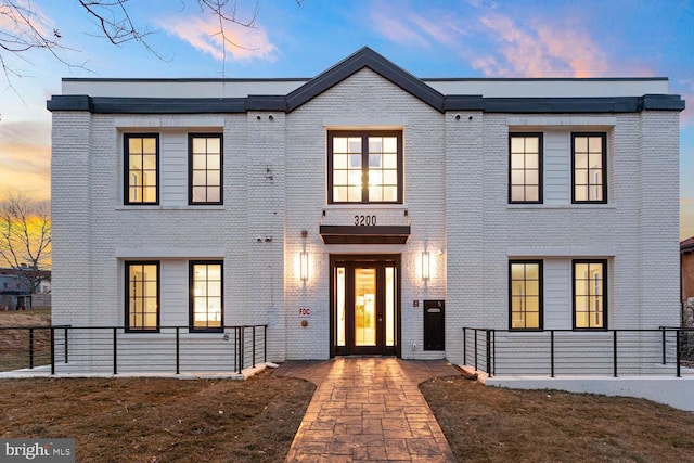 view of front of home with brick siding