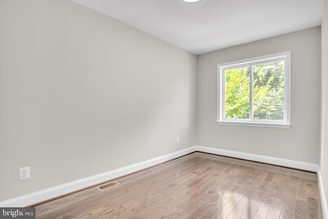 spare room with light hardwood / wood-style flooring