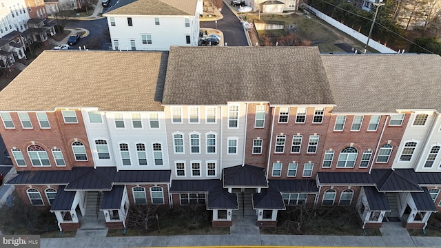 birds eye view of property with a residential view