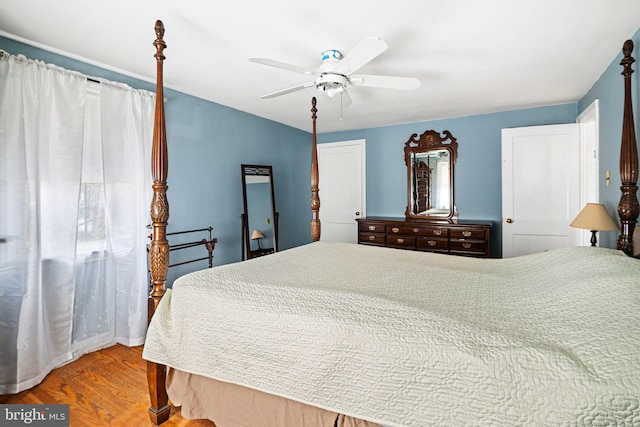 bedroom with ceiling fan and wood finished floors