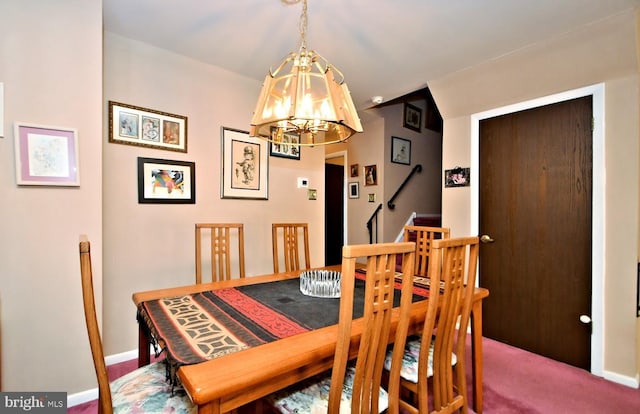 carpeted dining space with a chandelier