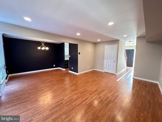 interior space featuring a chandelier and hardwood / wood-style floors