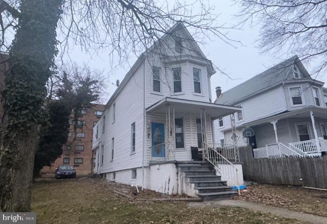 victorian-style house featuring a porch