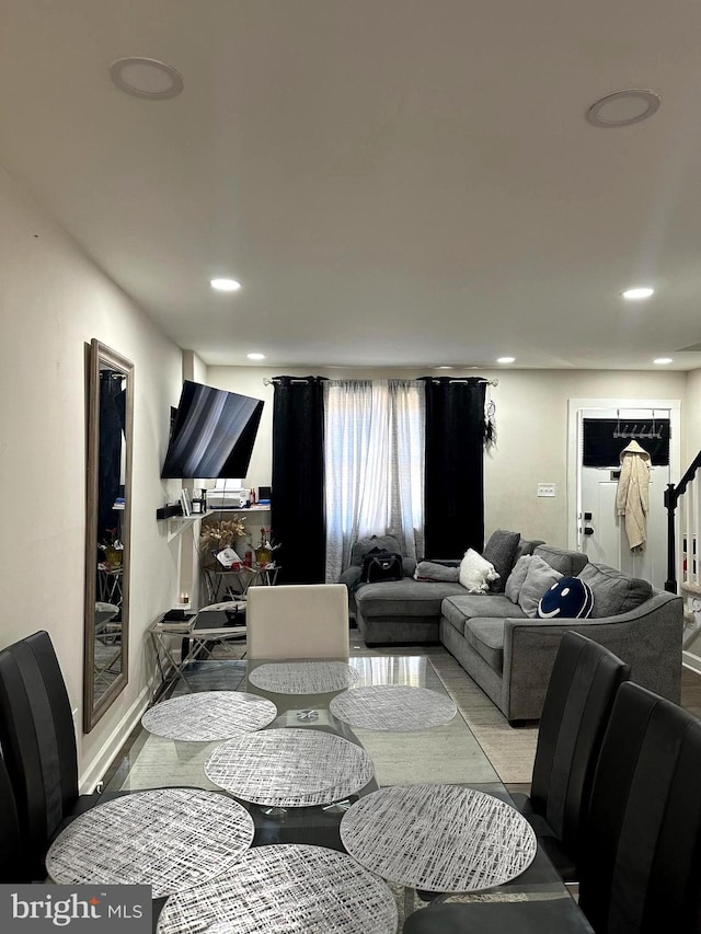 dining room featuring stairway and recessed lighting